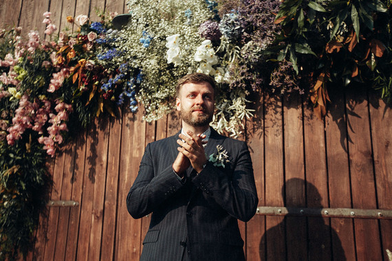 Rustic groom at ceremony