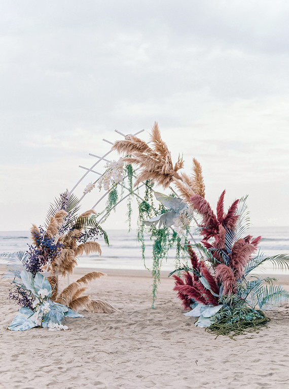 Dyed floral ceremony arch