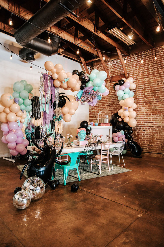 Pastel balloon and fringe backdrop for Halloween Inspiration