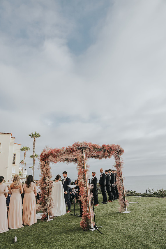 Pink babies breath wedding arch