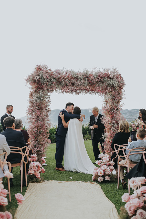 Pink babies breath wedding arch