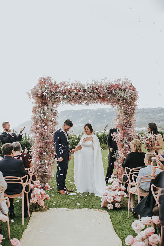 Pink babies breath wedding arch