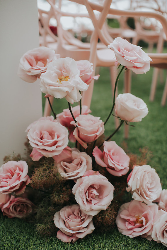 Gorgeous pink roses for wedding aisle