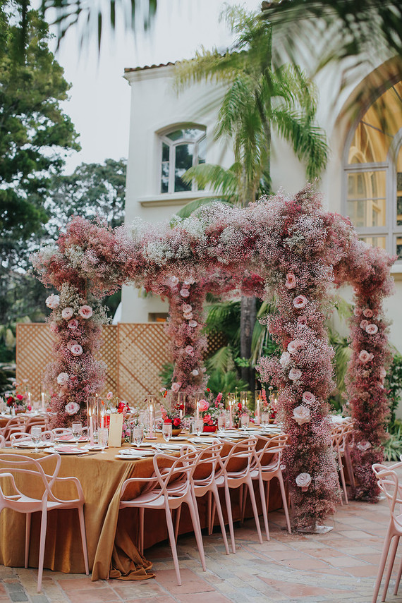 Pink babies breath wedding arch