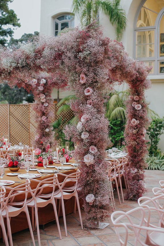 Pink babies breath wedding arch
