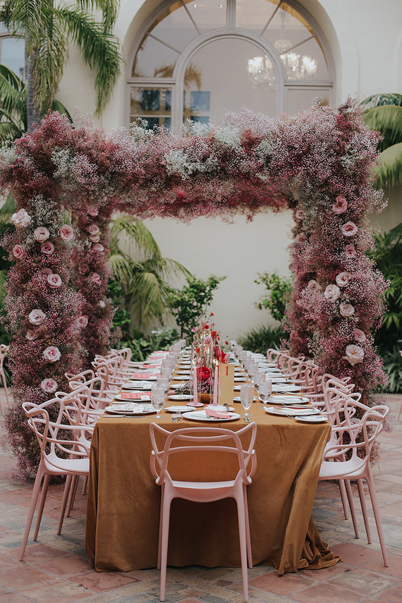 Pink babies breath wedding arch