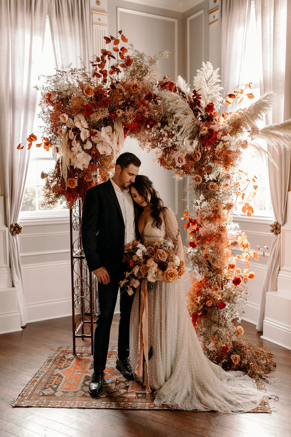 Lush fall floral ceremony arch Inspiration