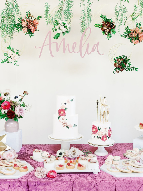 Floral first birthday cakes