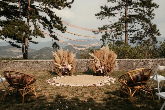 Modern bohemian wedding ceremony with pampas grass