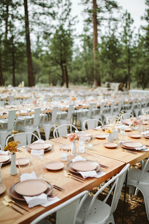 long reception table in forest wedding