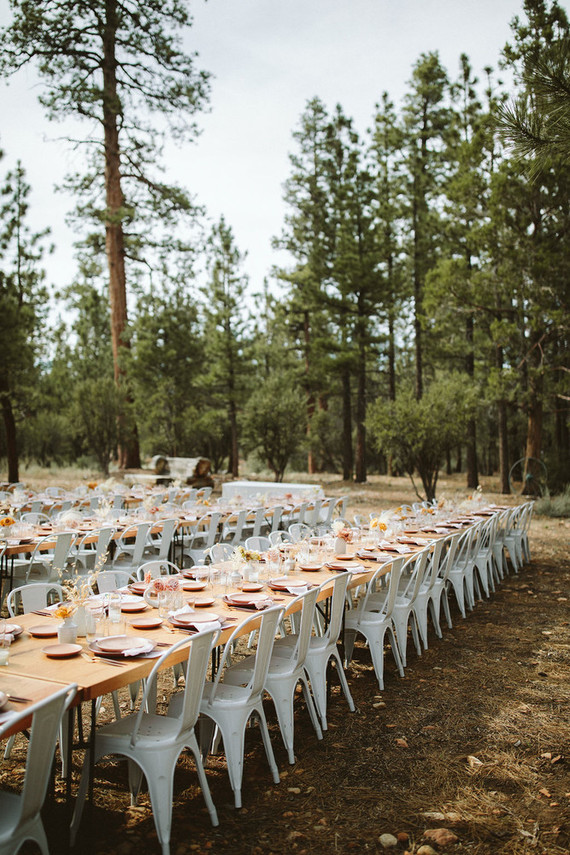 long reception table in forest wedding