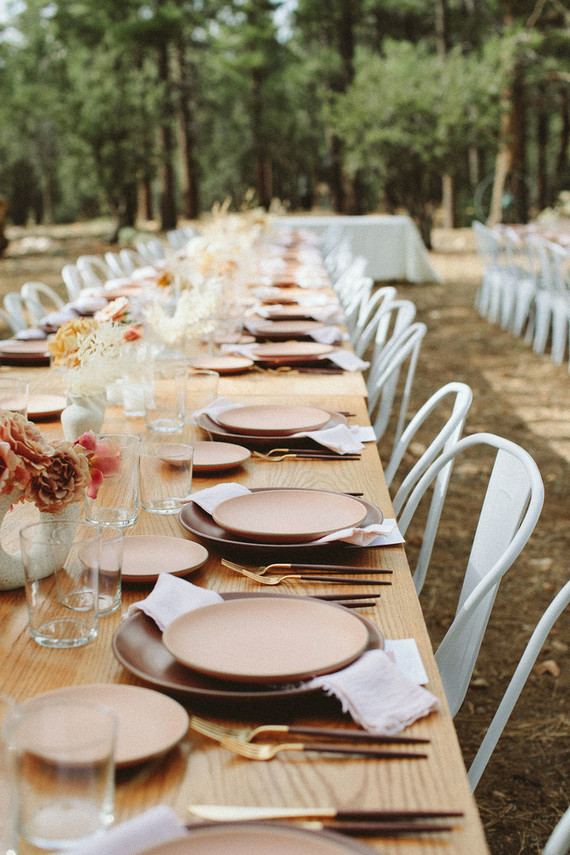long reception table in forest wedding