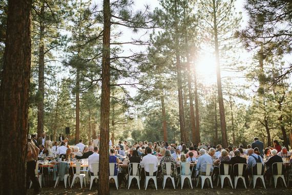 long reception table in forest wedding
