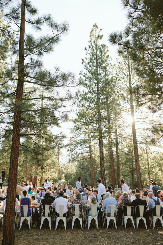 long reception table in forest wedding