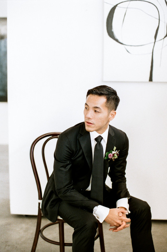 modern black groom's suit