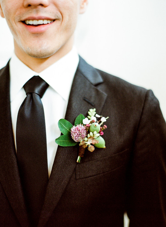 modern black groom's suit