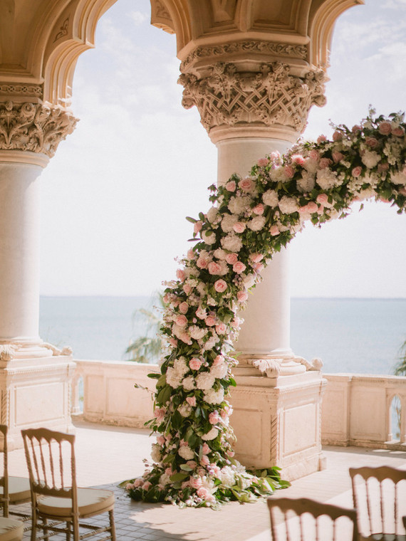 pink floral arch for ceremony