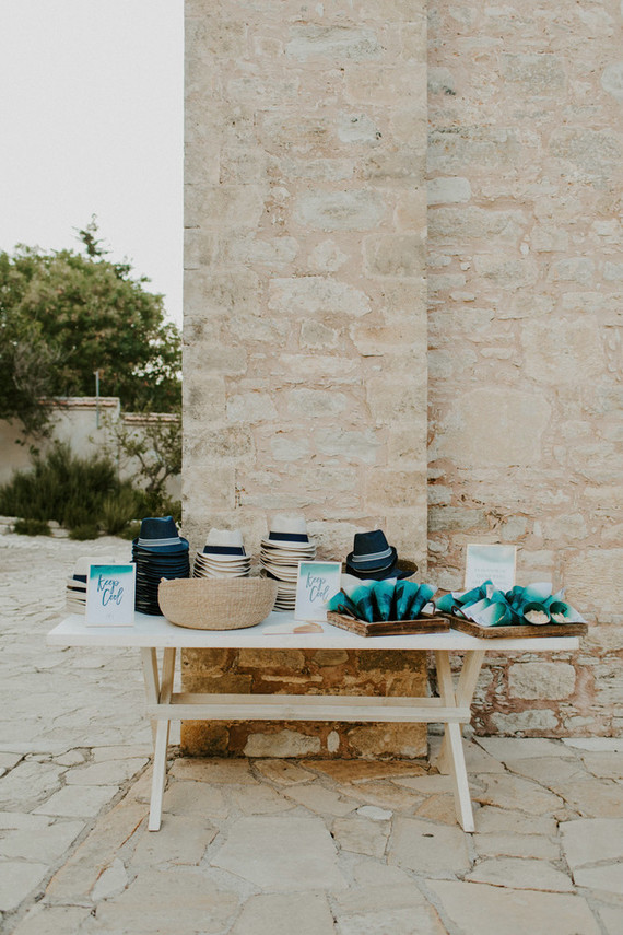 hat and fans for wedding ceremony