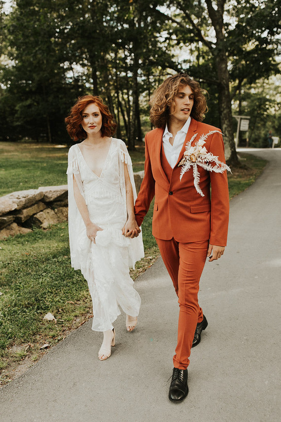 rust colored groom's suit