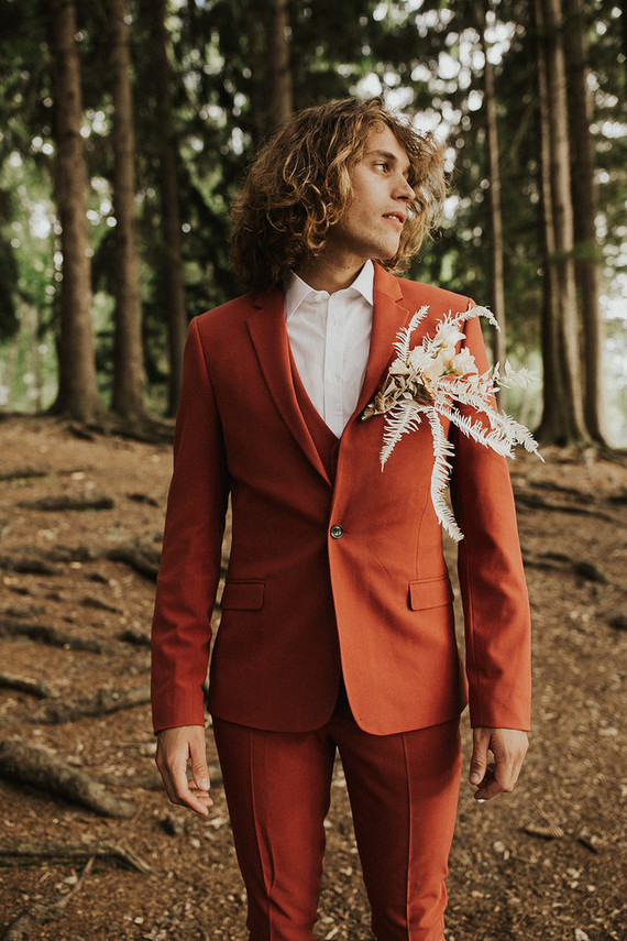 rust colored groom's suit
