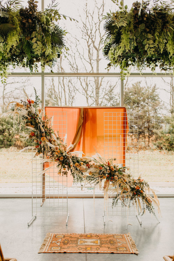 lush modern boho wedding ceremony floral installation