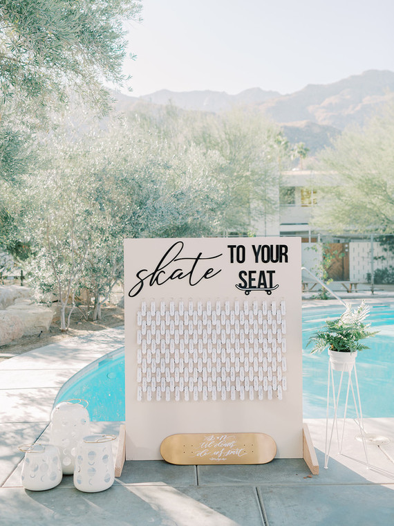 wedding calligraphy on skateboard escort cards