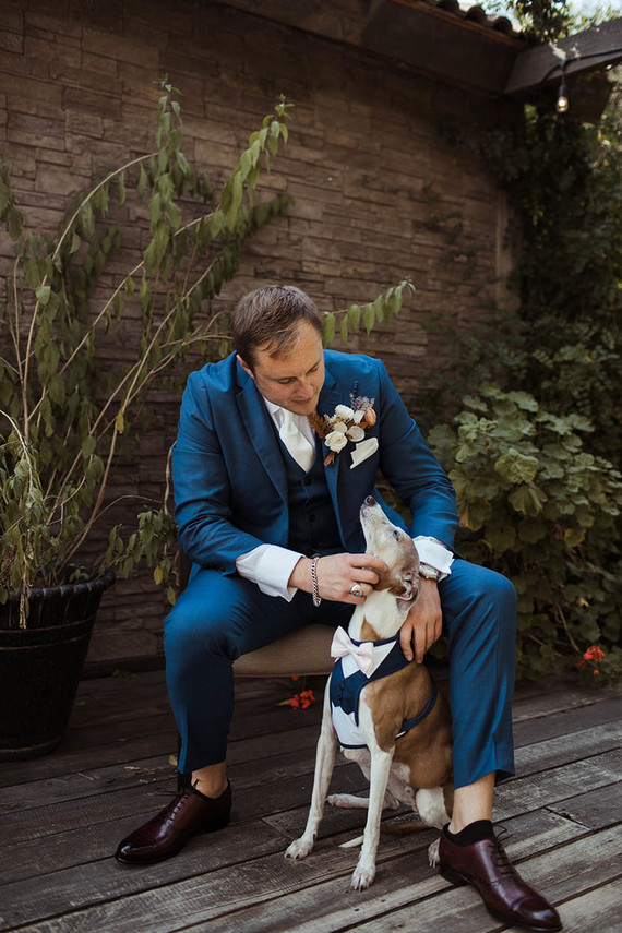 groom with dog