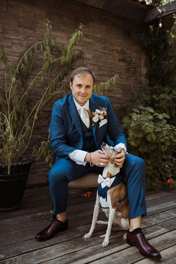 groom with dog