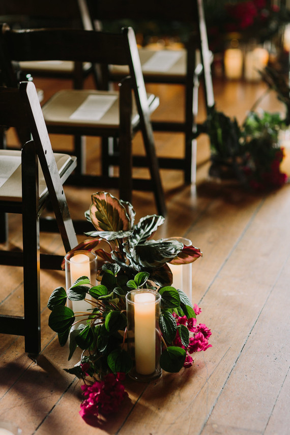 dramatic hollywood wedding ceremony with tropical plants