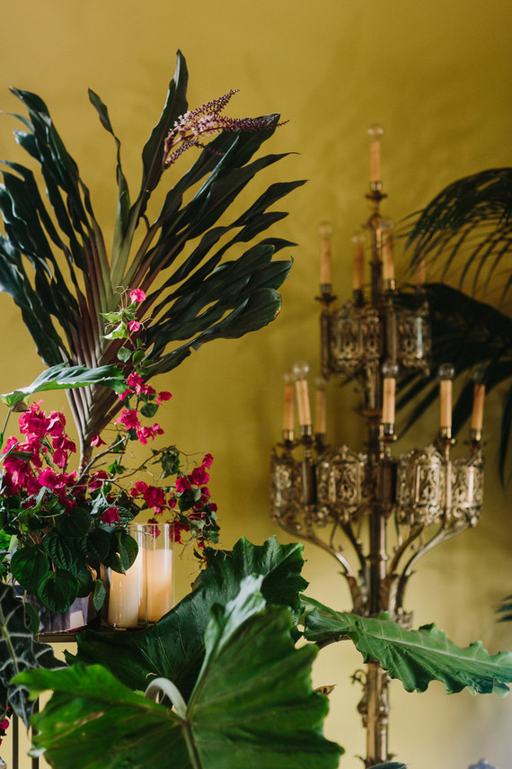 dramatic hollywood wedding ceremony with tropical plants