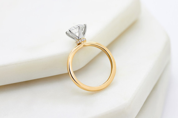 Mixed metal solitaire engagement ring