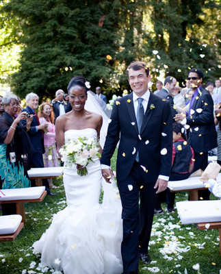 Beautiful modern couple walking down aisle