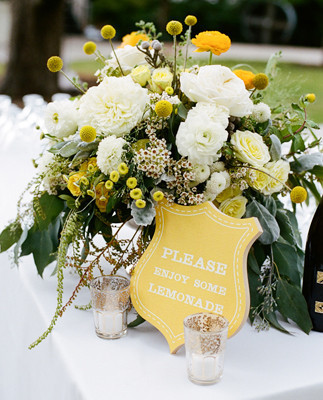 Yellow floral arrangements and sign