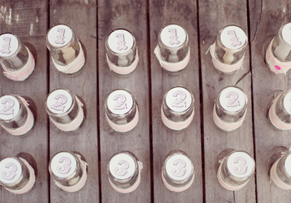 Pink table number bottles