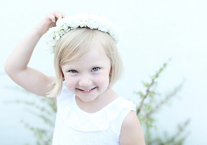 white flower girl dress and floral crown