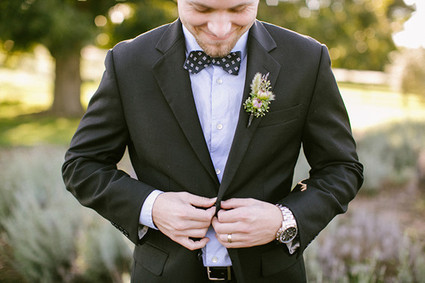Black and purple tux with polka dot bow tie