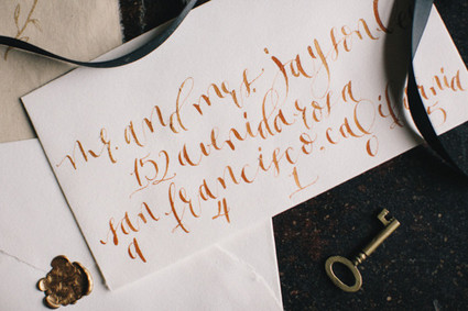 Orange calligraphy wedding envelope