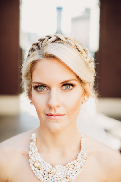 Modern wedding braided hairstyle with chunky necklace