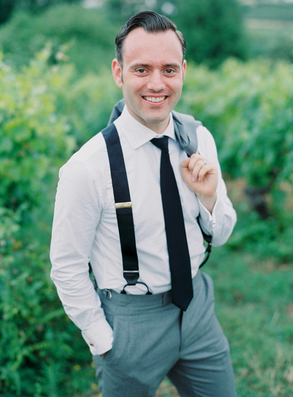 Groom with black suspenders