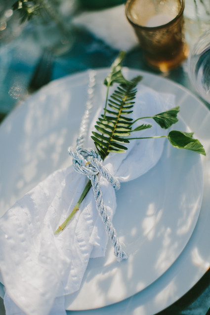 White napkin with green leaf