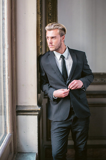 Groom in black and white tux