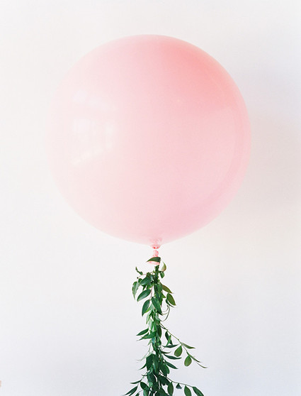 Giant pink balloon with floral string