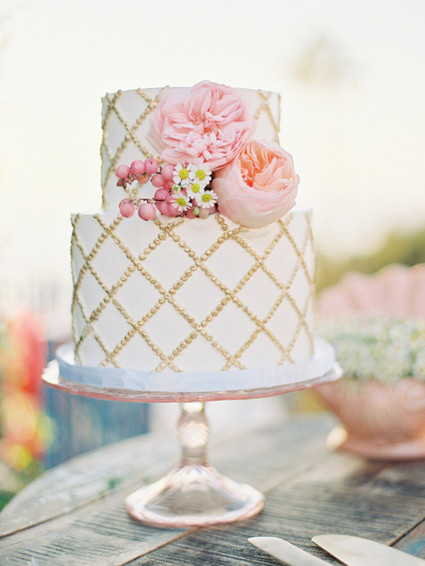 White, pink and gold wedding cake