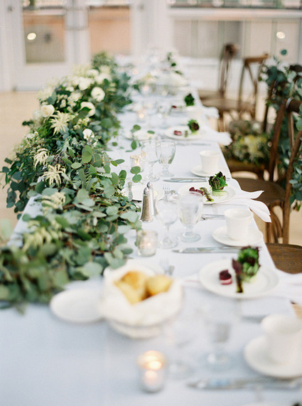 White tablescape with eucalyptus decor