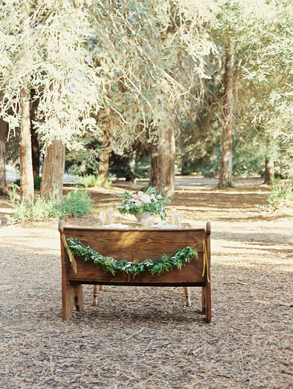 Wooden tablescape with garland