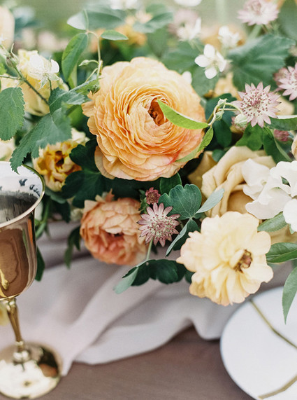 Orange ranunculus floral centerpiece
