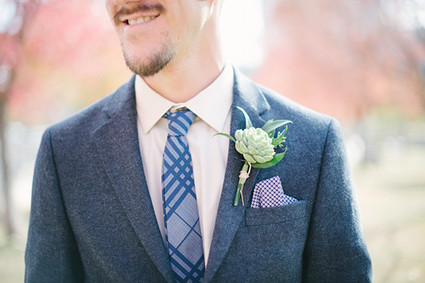 Blue and white suit with green boutonnière