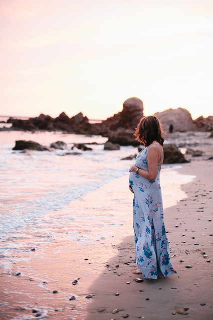Beach maternity photos by Megan Welker