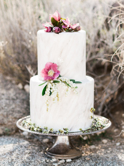White cake with silver stand