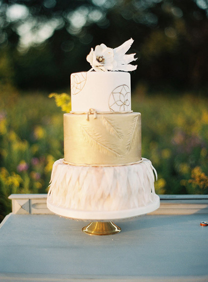 Gold and white cake with feathers